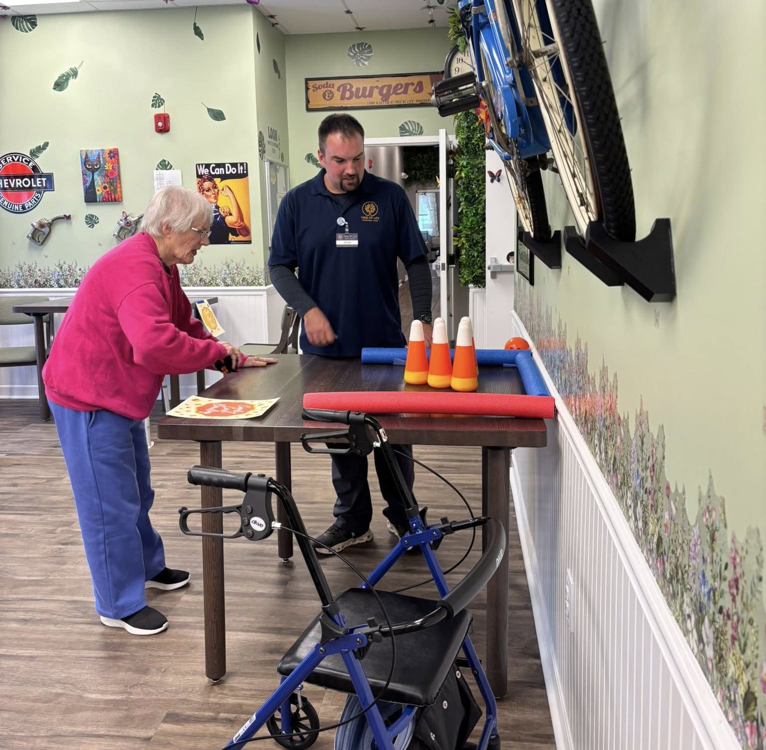 560325530_1119505180335246_4111731748215572712_n copy A staff member assisting a senior